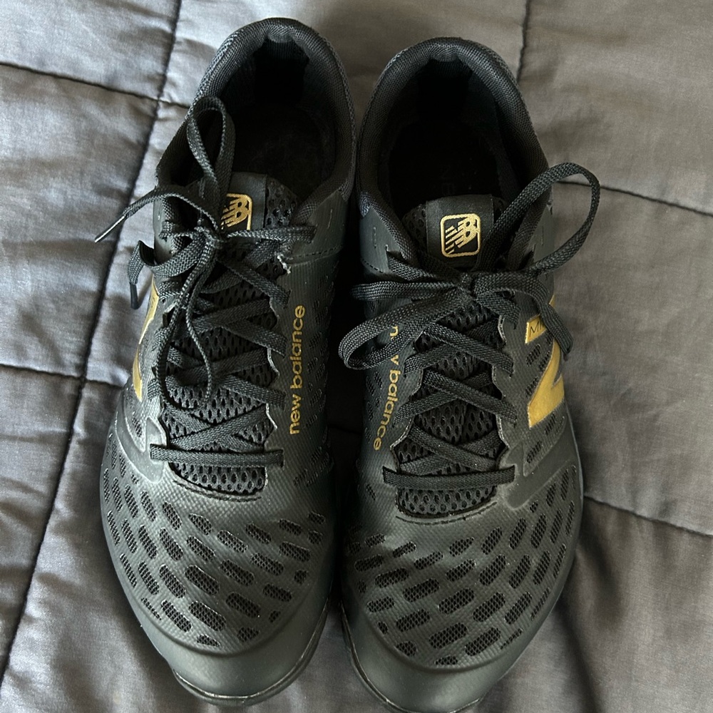 New Balance Black and Gold Sneakers
